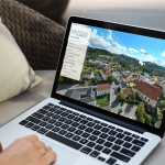 About 1 mockup of a woman using a macbook at home 2330 el1 1